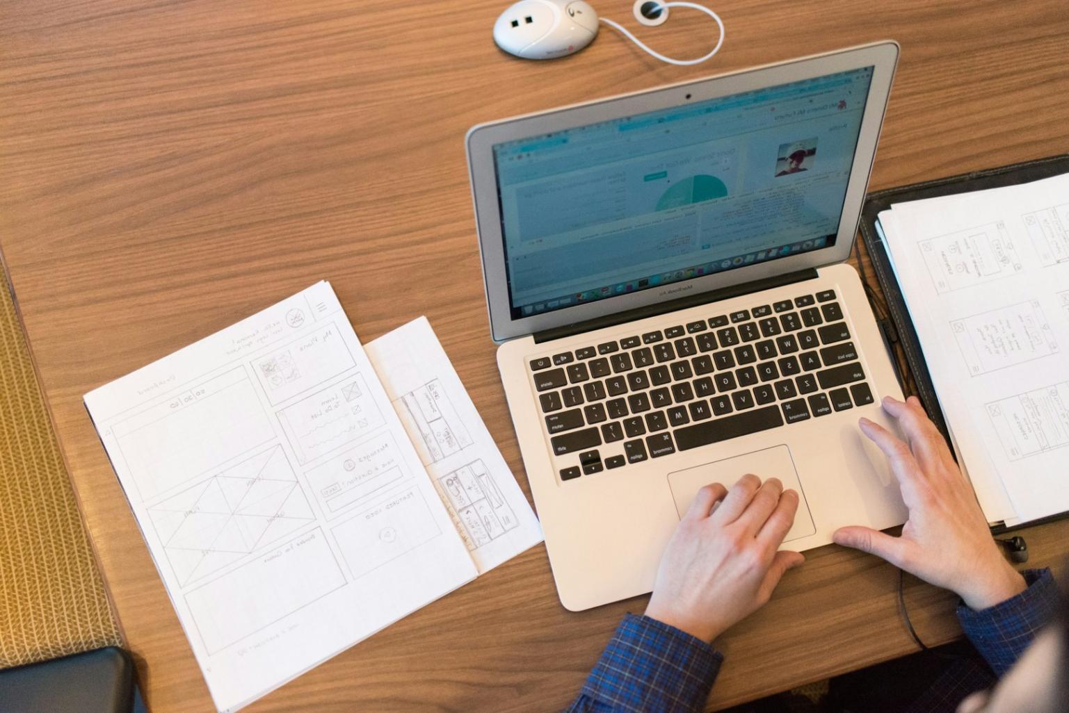 Students working on blockchain media projects in modern learning environment